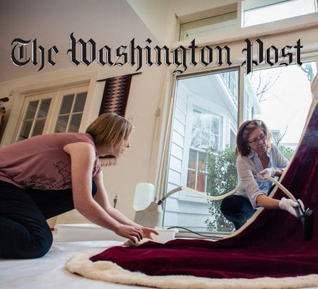 Julia Brennan and a colleague examine Lady Astor’s 1937 coronation gown during textile conservation work featured in The Washington Post.