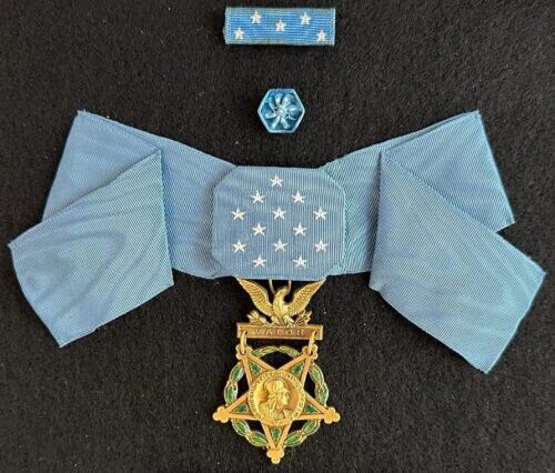Medal of Honor with blue ribbon displayed after treatment.