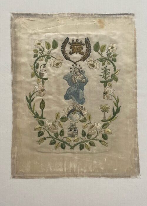Antique silk embroidery of Mary after treatment.