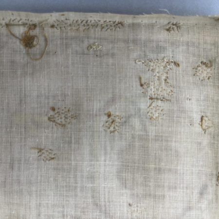 Linen sampler with 19th century darning repairs .