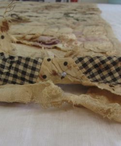 Frederick Douglass tattered quilt before restoration.