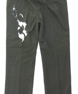 Frederick Douglass black trousers with significant damage on right side before restoration.