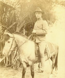 Young Smedley Butler in military uniform seated on horseback.
