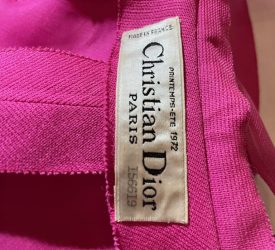 Interior label of a fuchsia gown reading “Christian Dior Paris, Printemps–Été 1972, Made in France.”