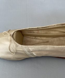 Mother Seton's ivory silk slipper with pointed toes and embroidered monograms.