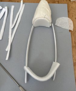 Reconstruction of Mother Seton's ivory silk slipper during treatment process.