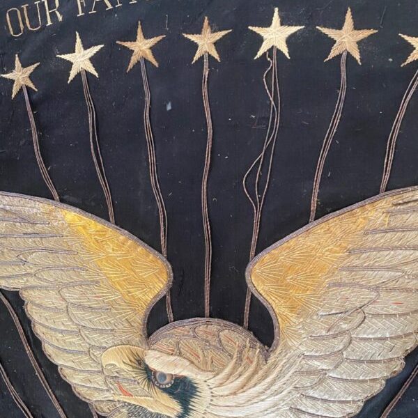 Damaged stars and eagle flag stating "Our Famous Cruise Around the World"