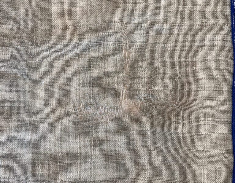 Front view of patched linen fabric