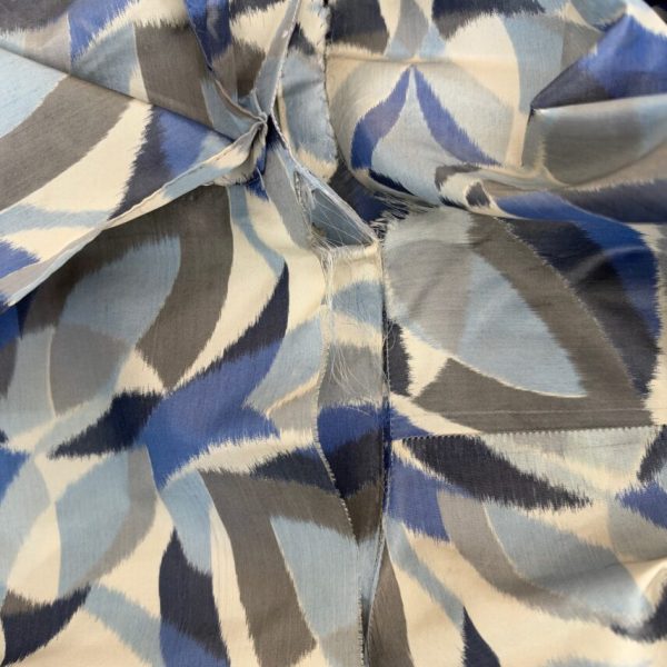 silk fabric in abstract leaf print before repair